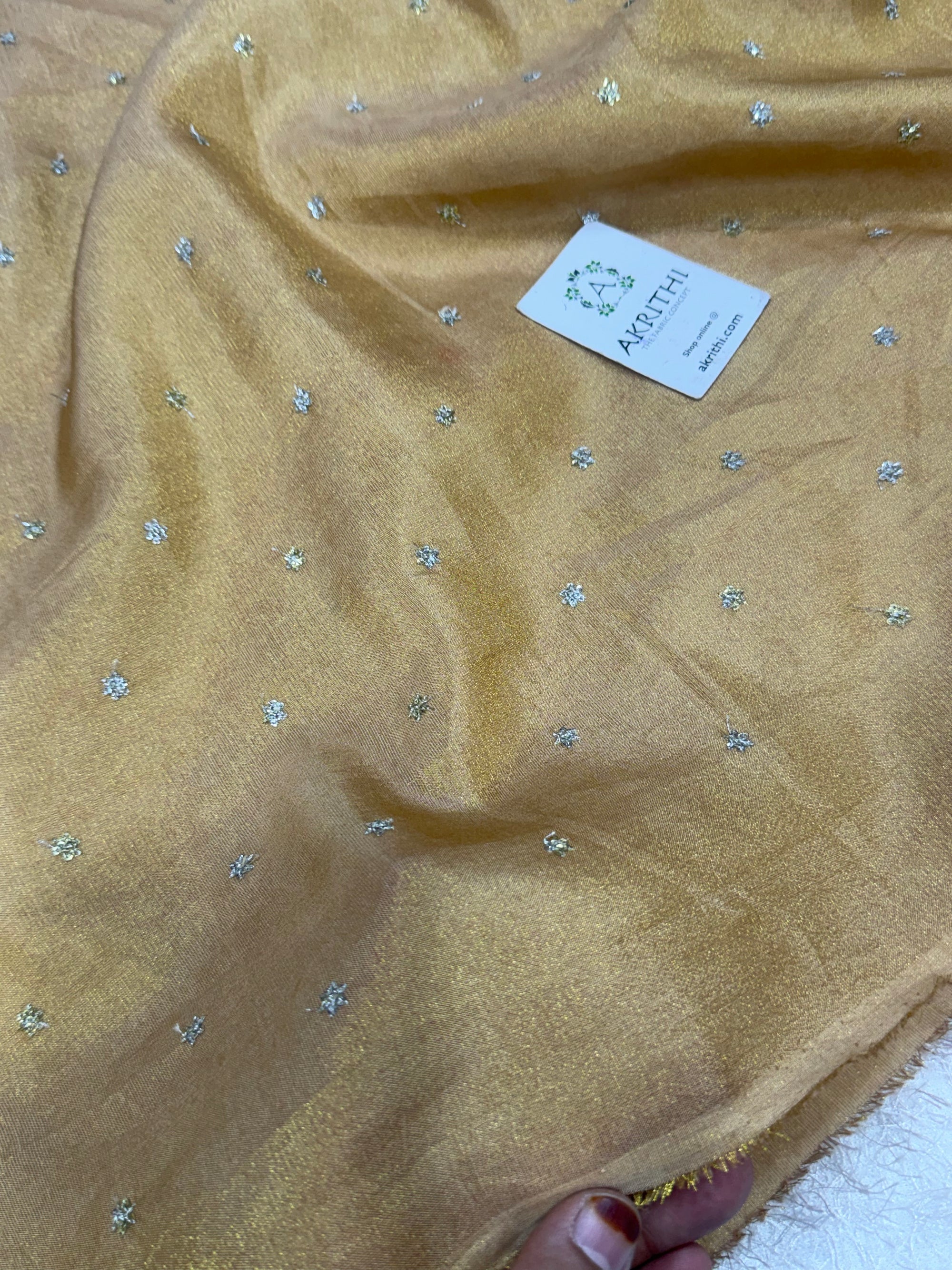 Sequins on tissue crepe fabric