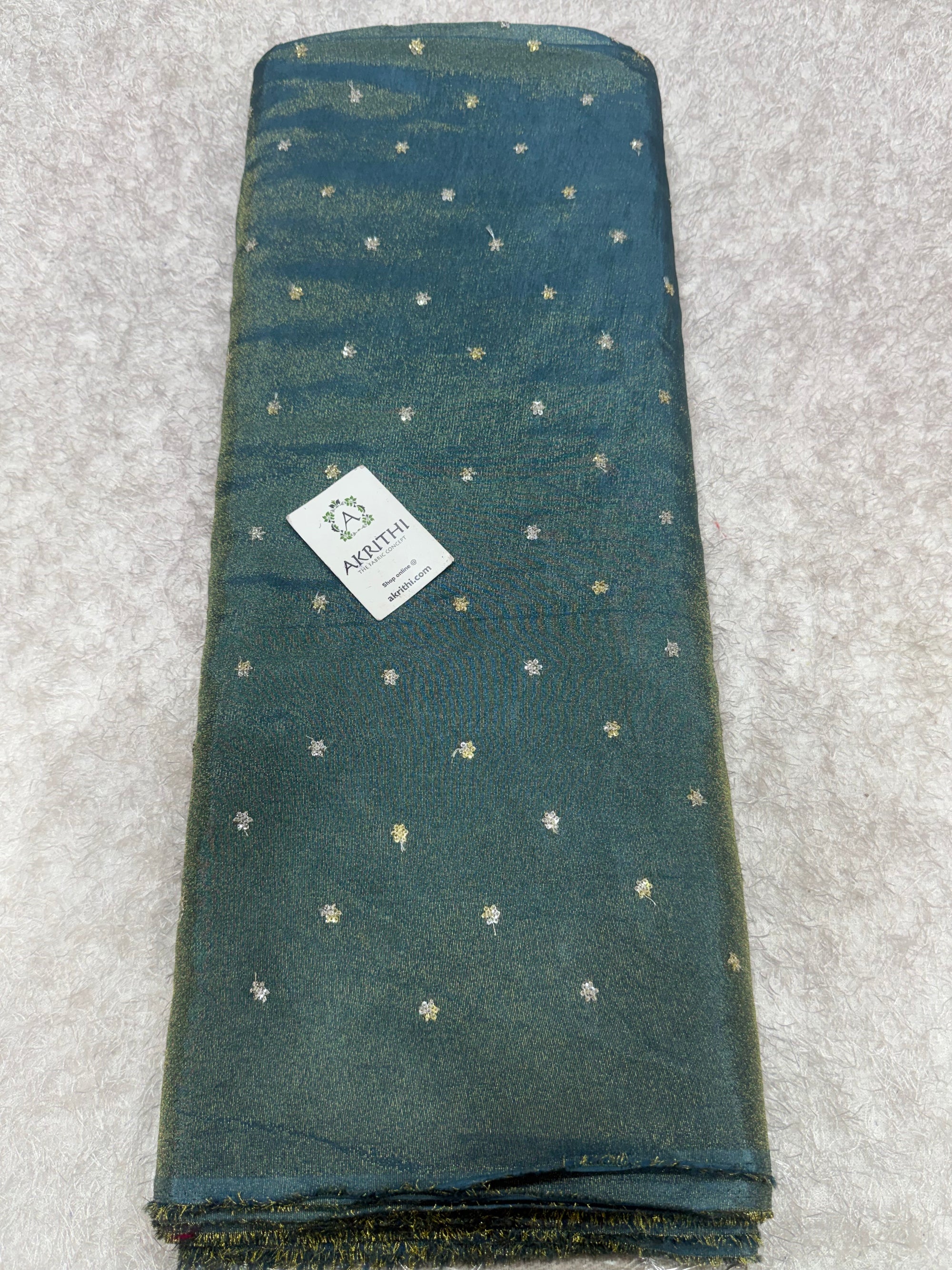 Sequins on tissue crepe fabric