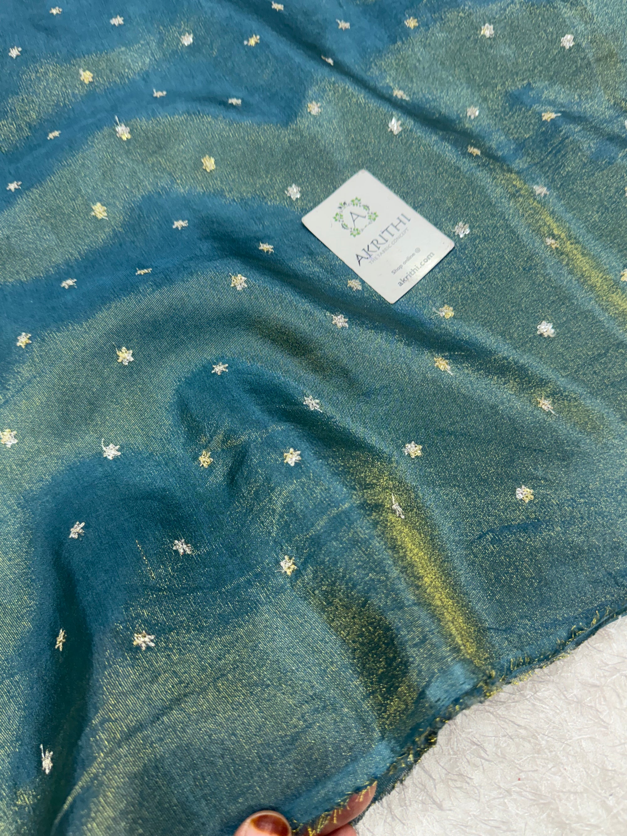 Sequins on tissue crepe fabric