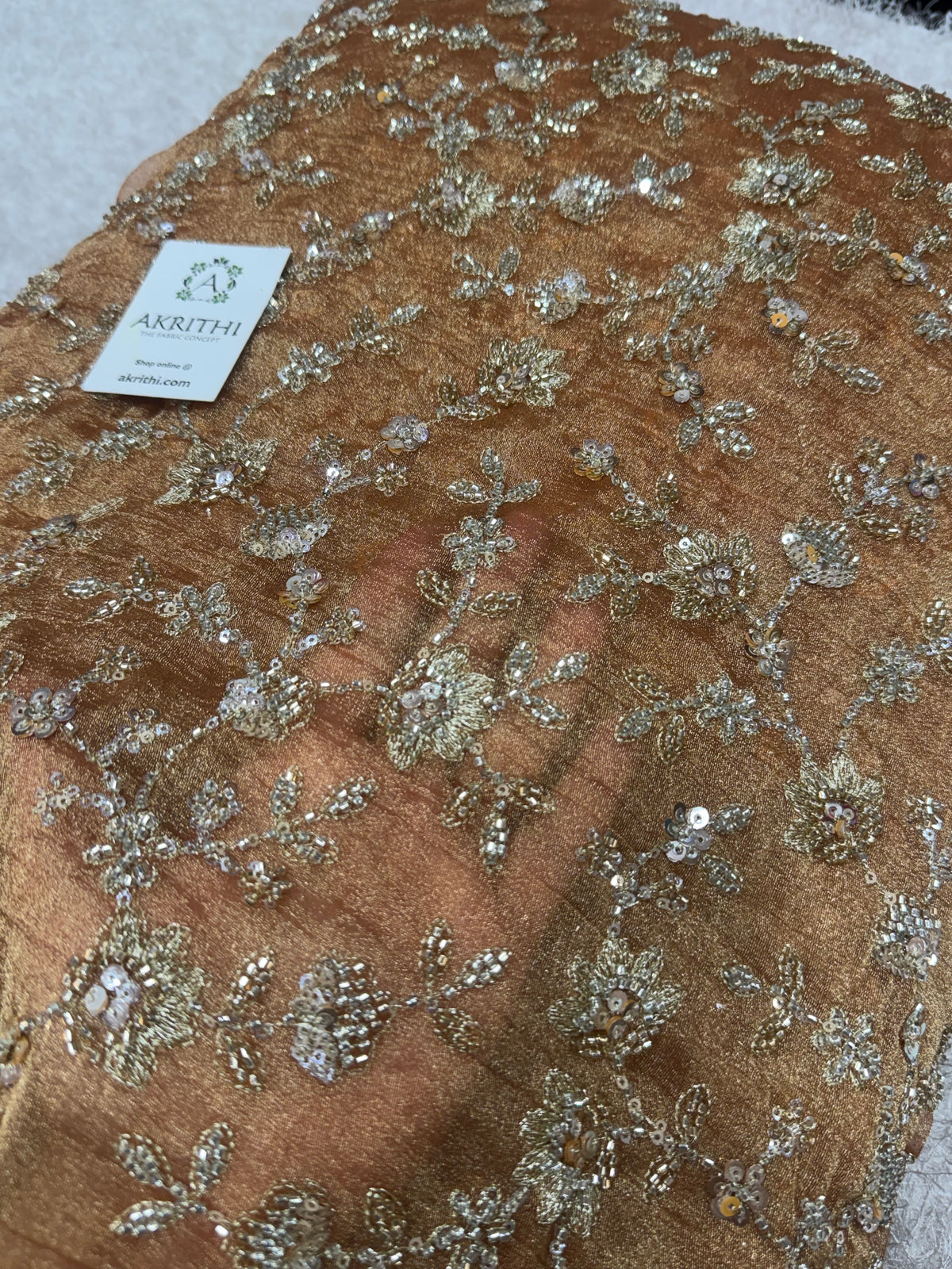 Embroidered crushed tissue fabric