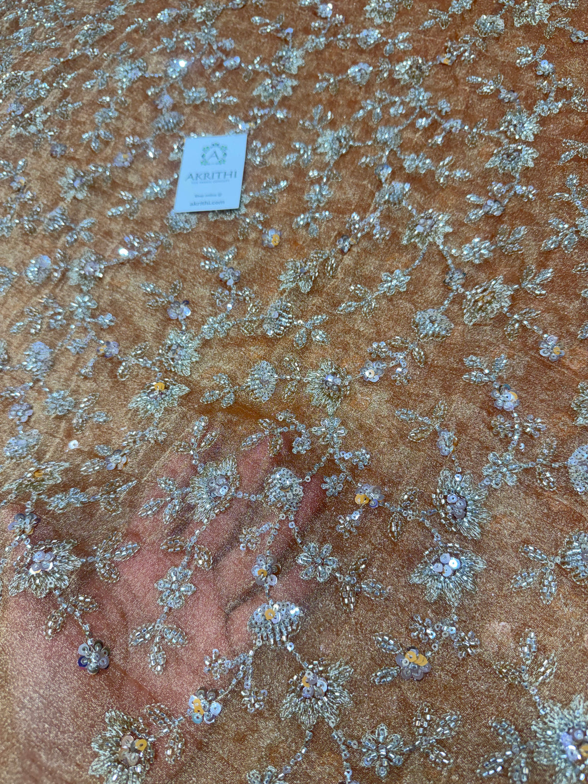 Embroidered crushed tissue fabric