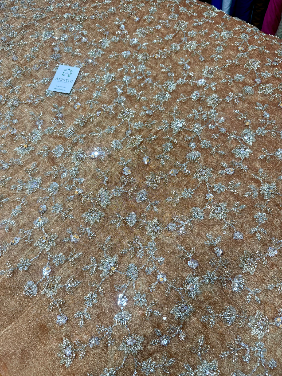 Embroidered crushed tissue fabric