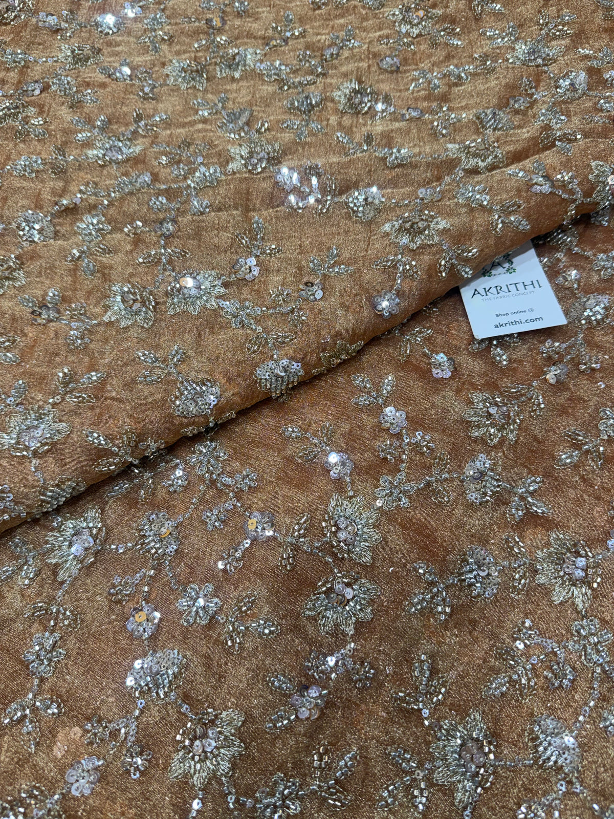 Embroidered crushed tissue fabric