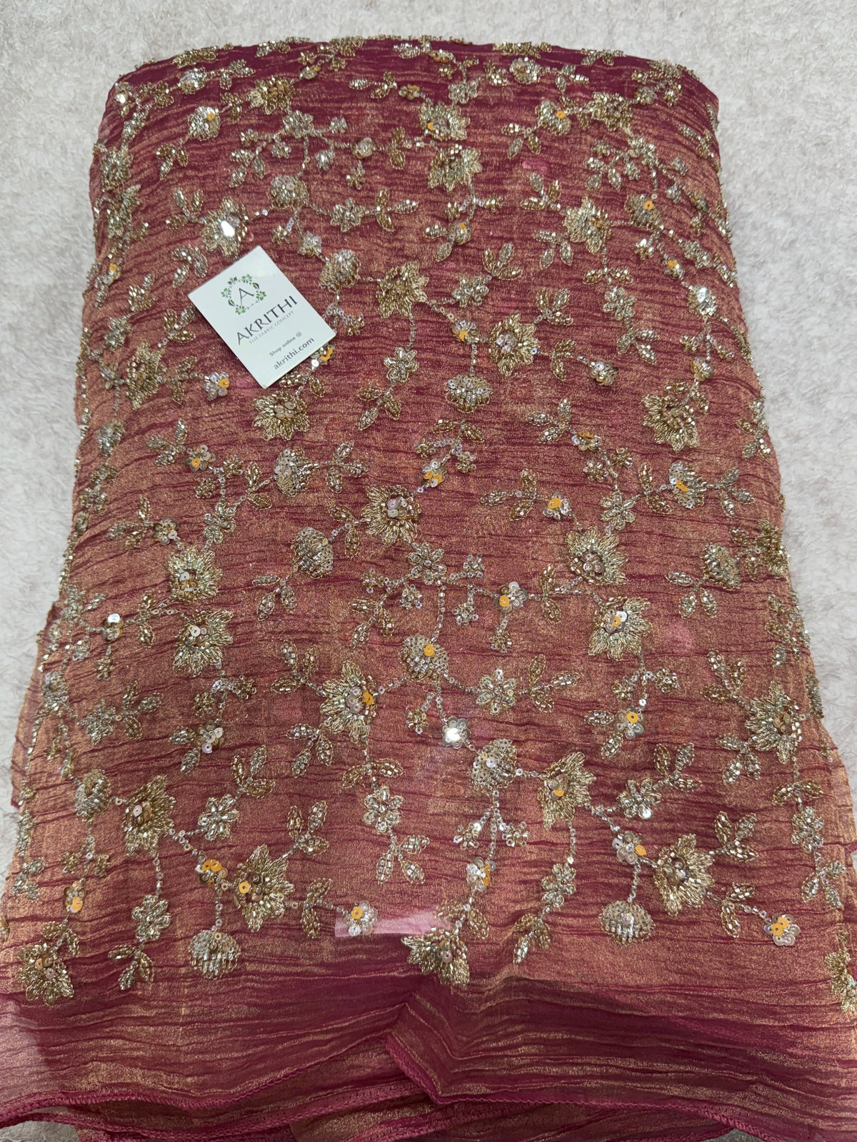 Embroidered crushed tissue fabric