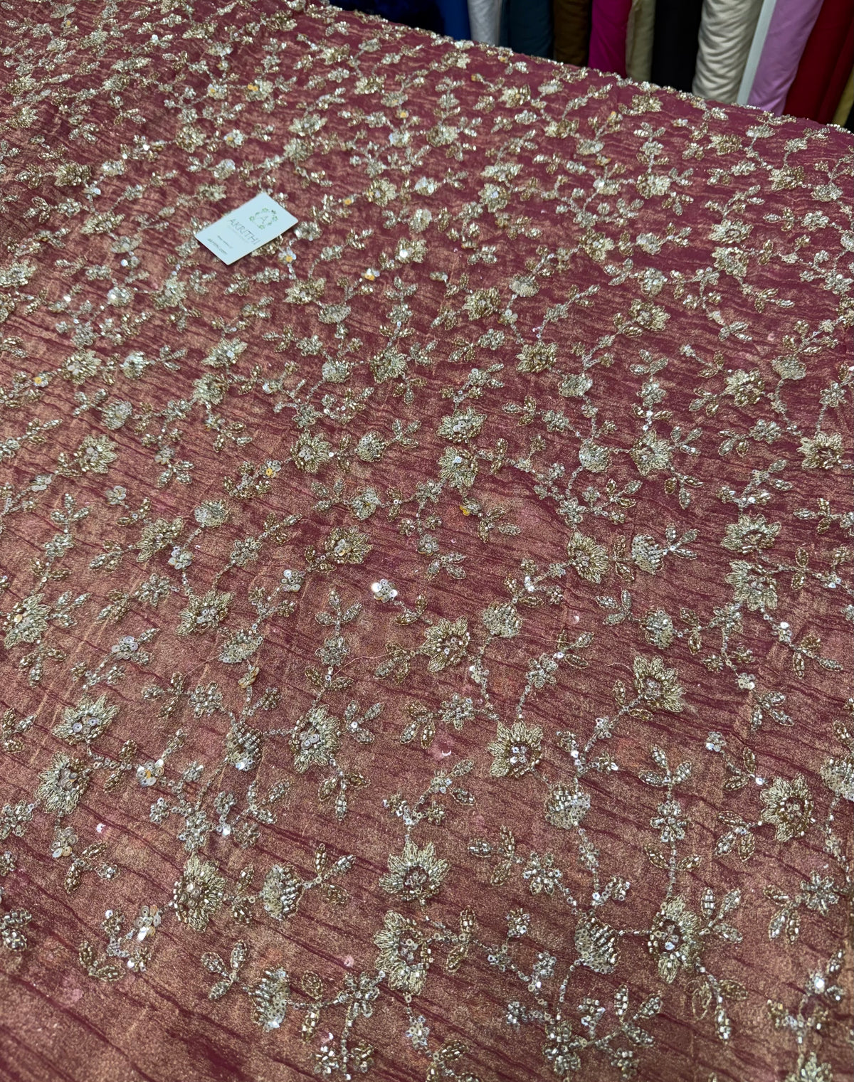 Embroidered crushed tissue fabric