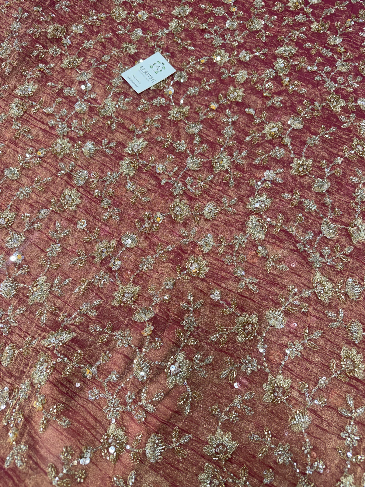 Embroidered crushed tissue fabric