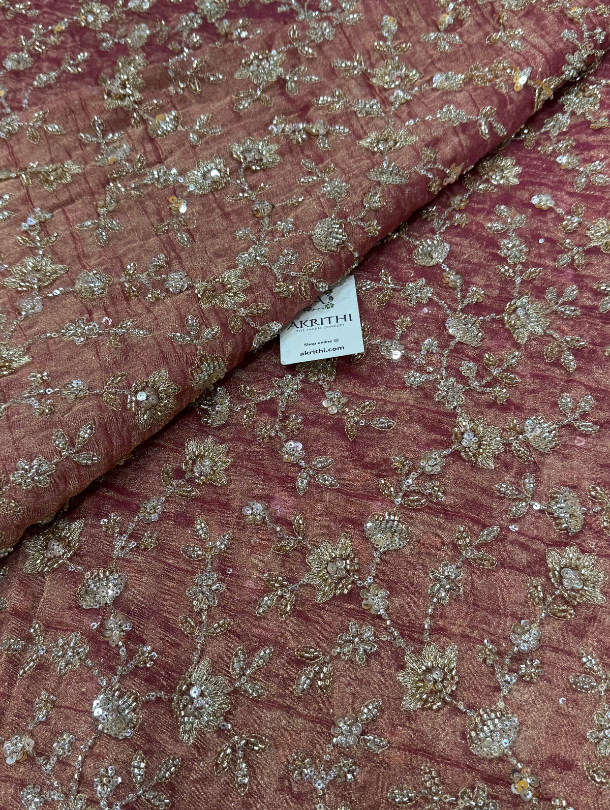 Embroidered crushed tissue fabric