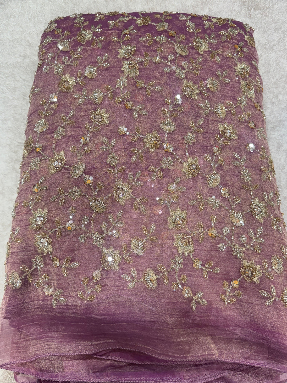Embroidered crushed tissue fabric