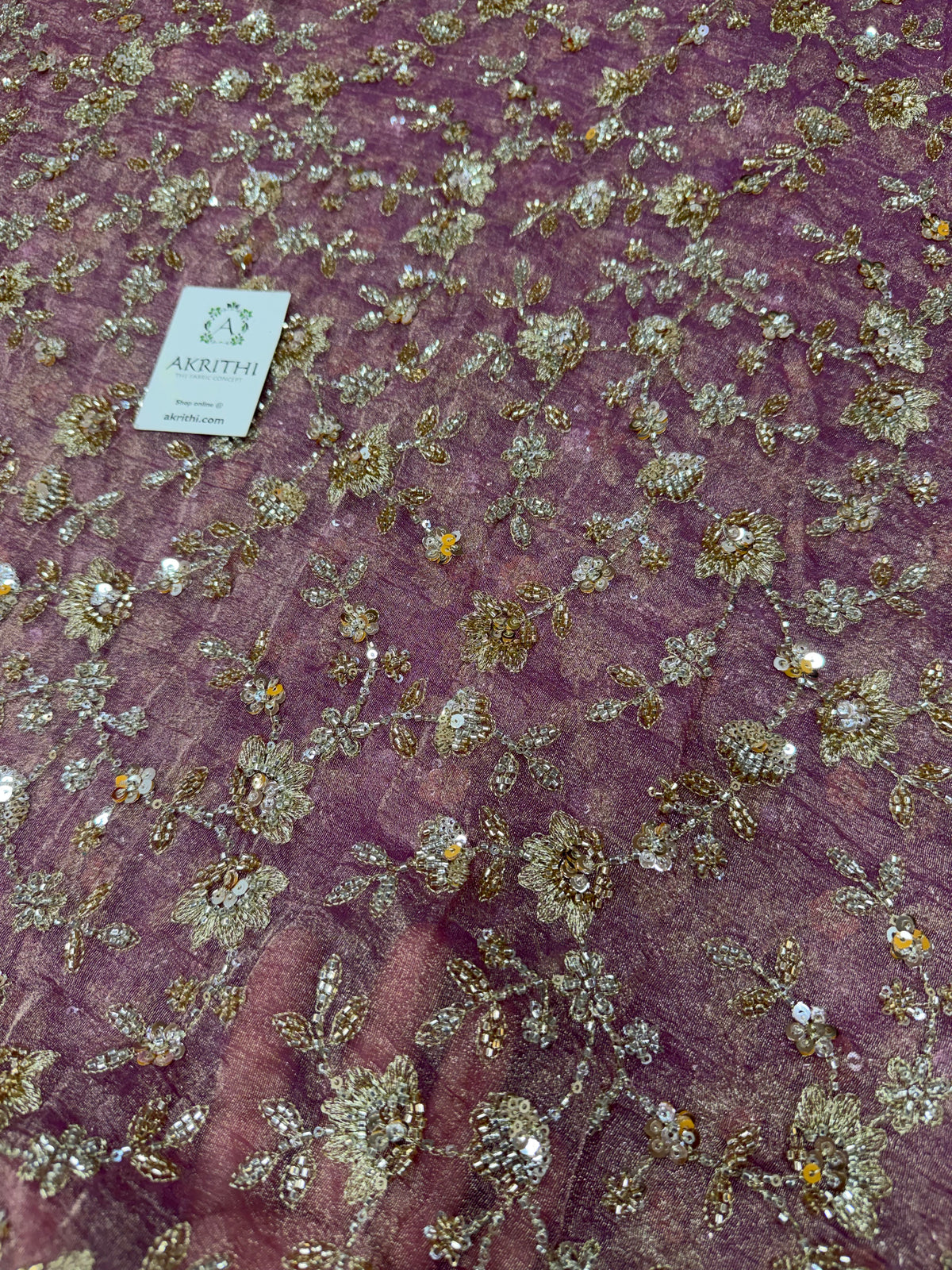 Embroidered crushed tissue fabric