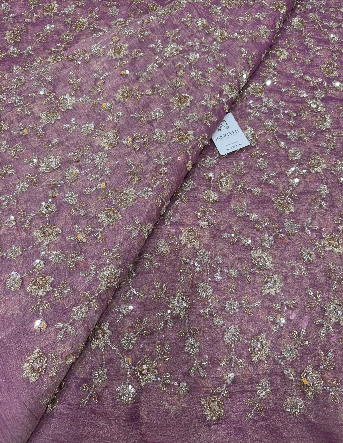 Embroidered crushed tissue fabric