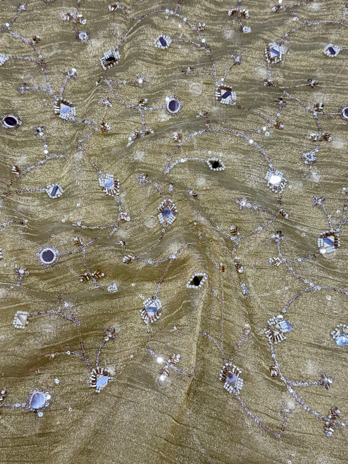 Embroidered crushed tissue fabric