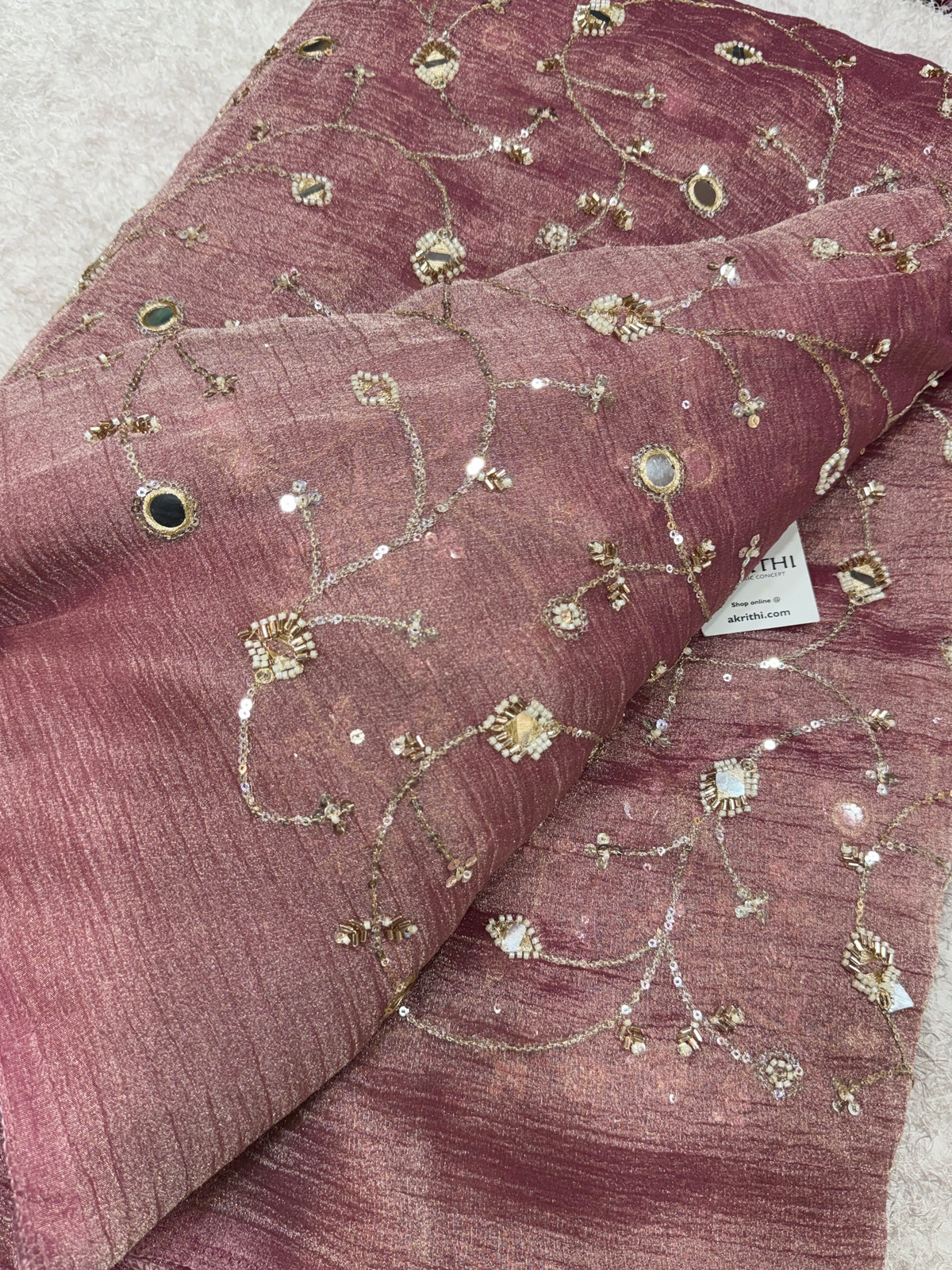 Embroidered crushed tissue fabric