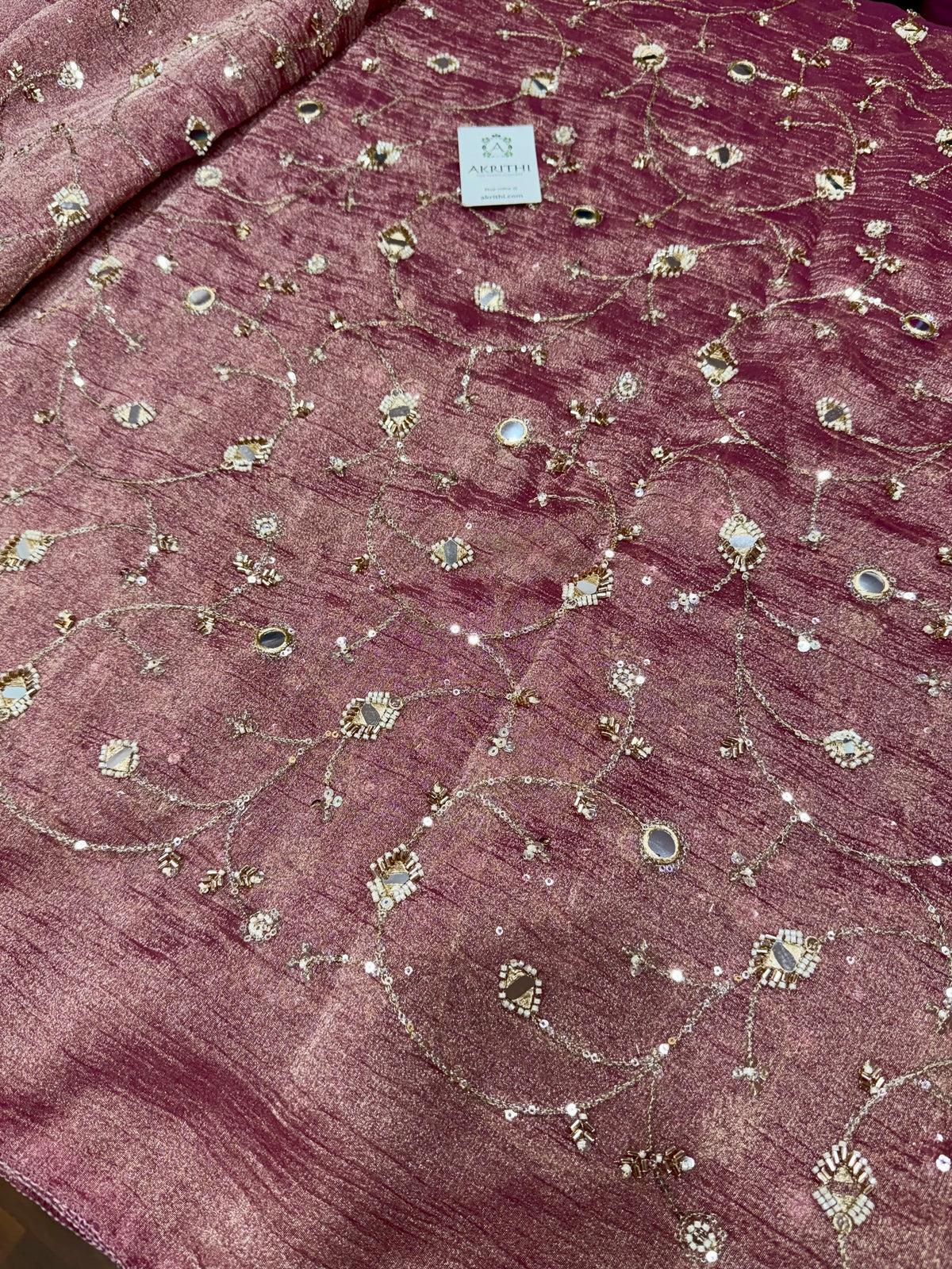 Embroidered crushed tissue fabric