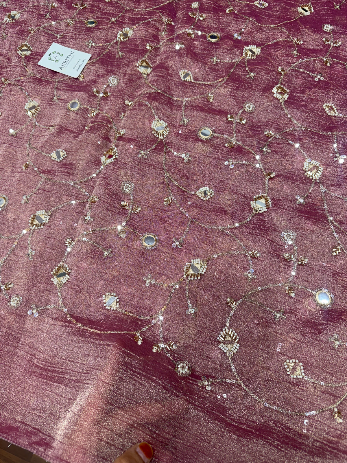 Embroidered crushed tissue fabric