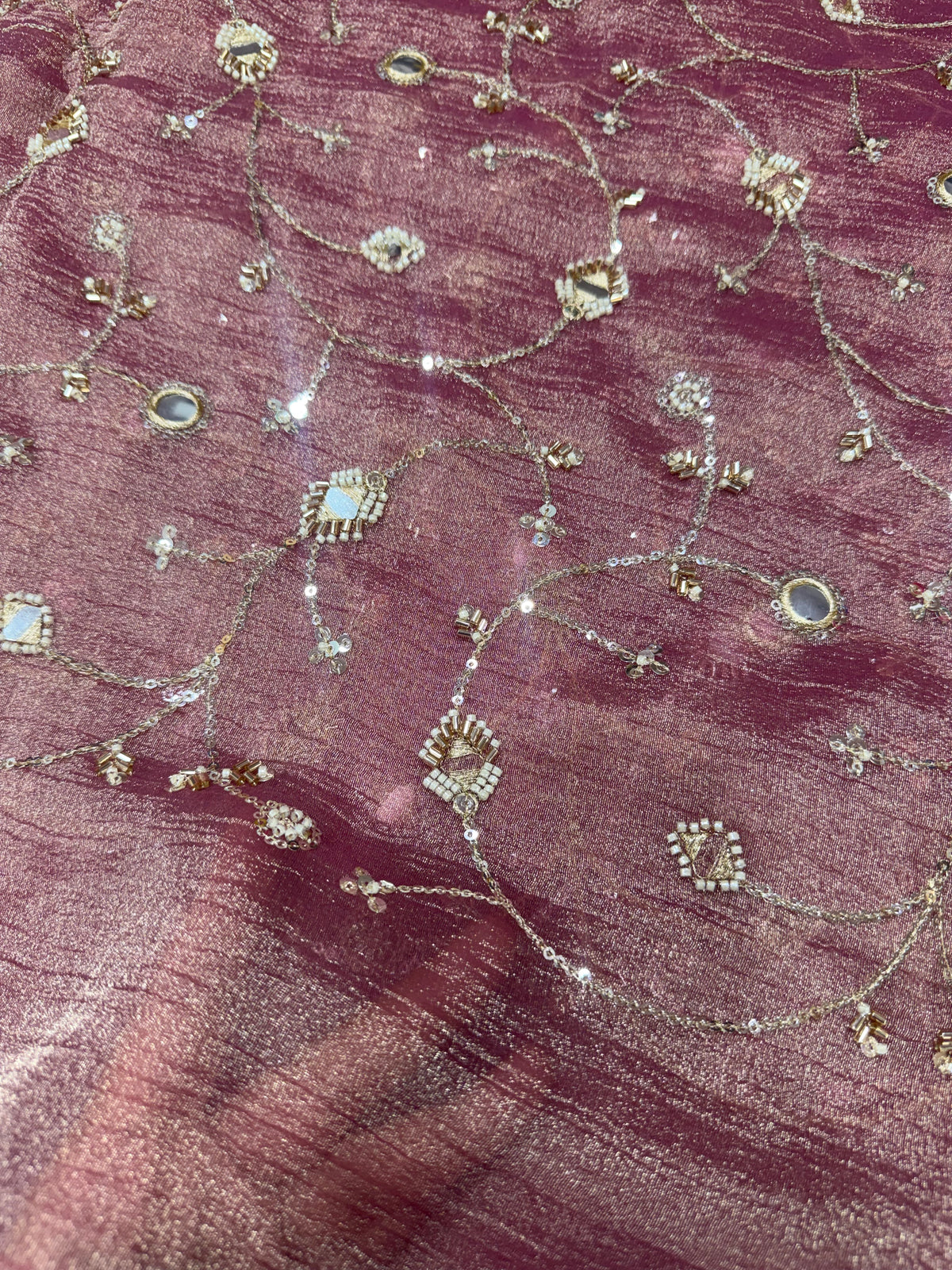 Embroidered crushed tissue fabric