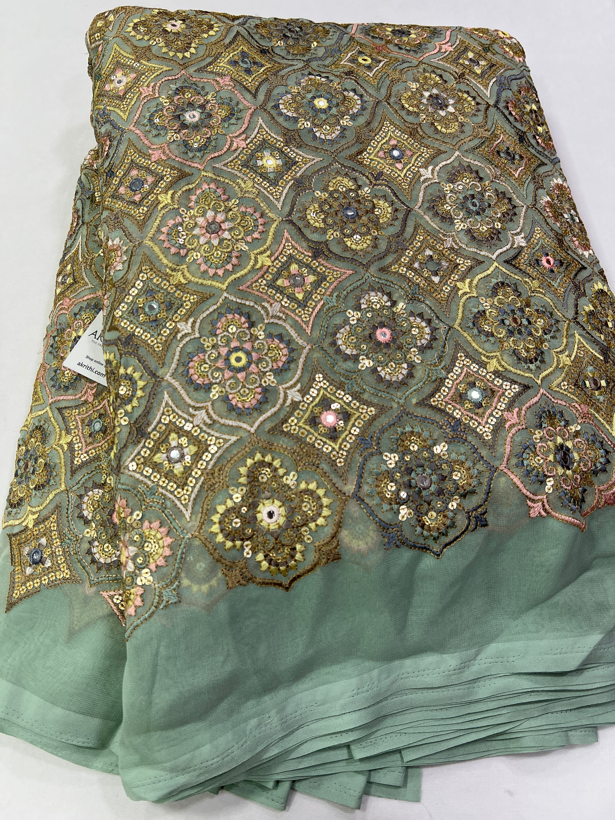 Heavy Embroidery on slate green Georgette fabric