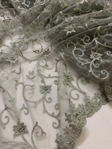 Embroidery on grey net fabric