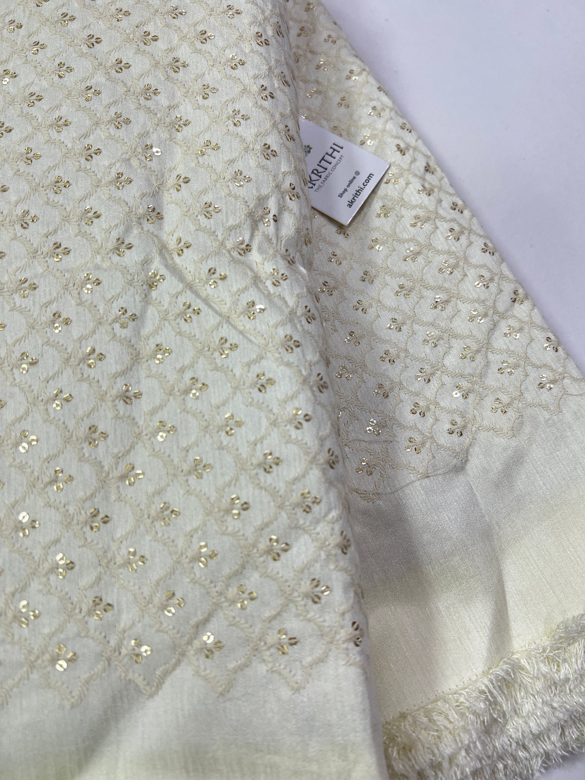 Embroidery on raw silk fabric