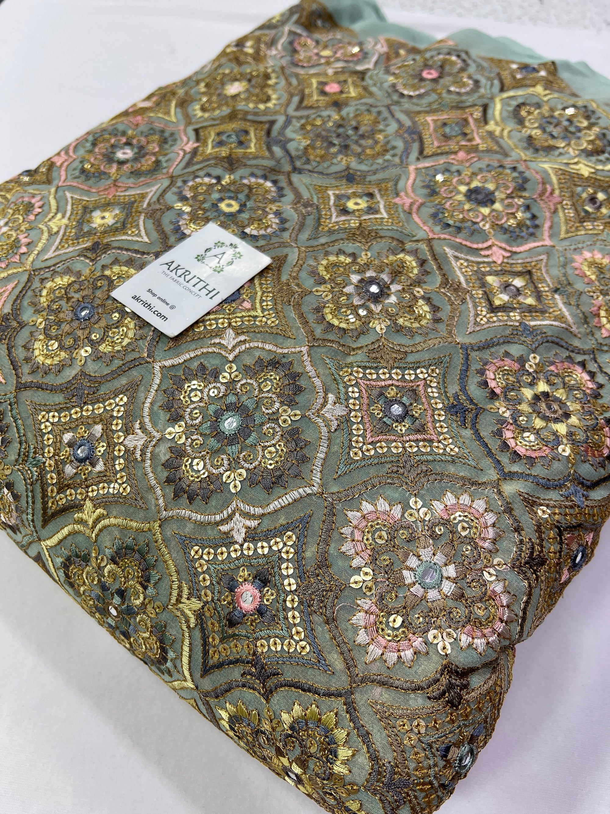 Heavy Embroidery on slate green Georgette fabric
