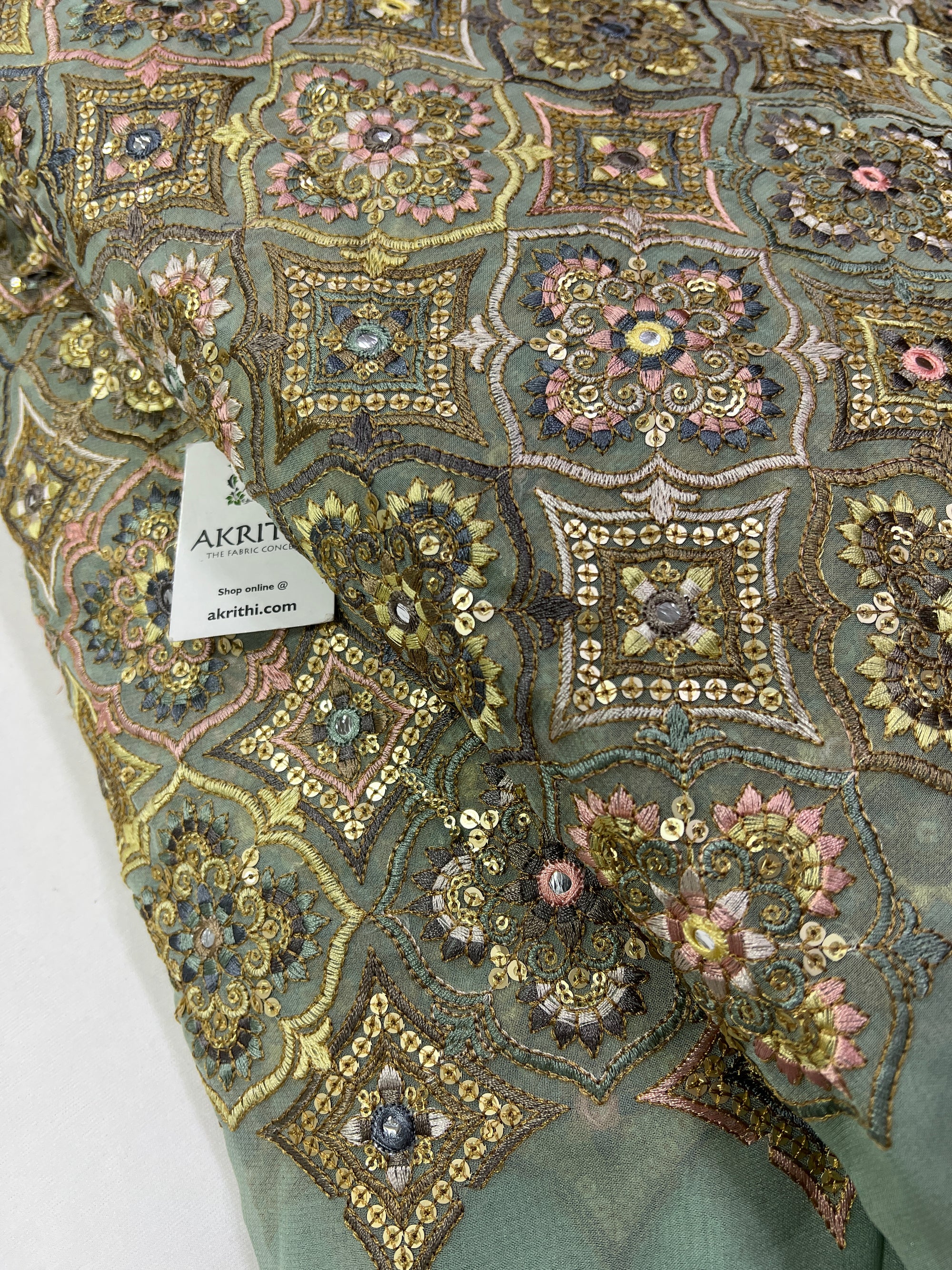 Heavy Embroidery on slate green Georgette fabric