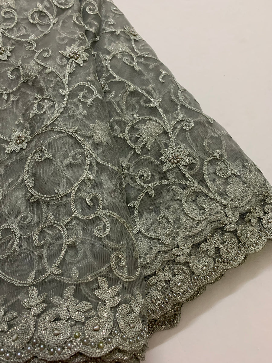 Embroidery on grey net fabric