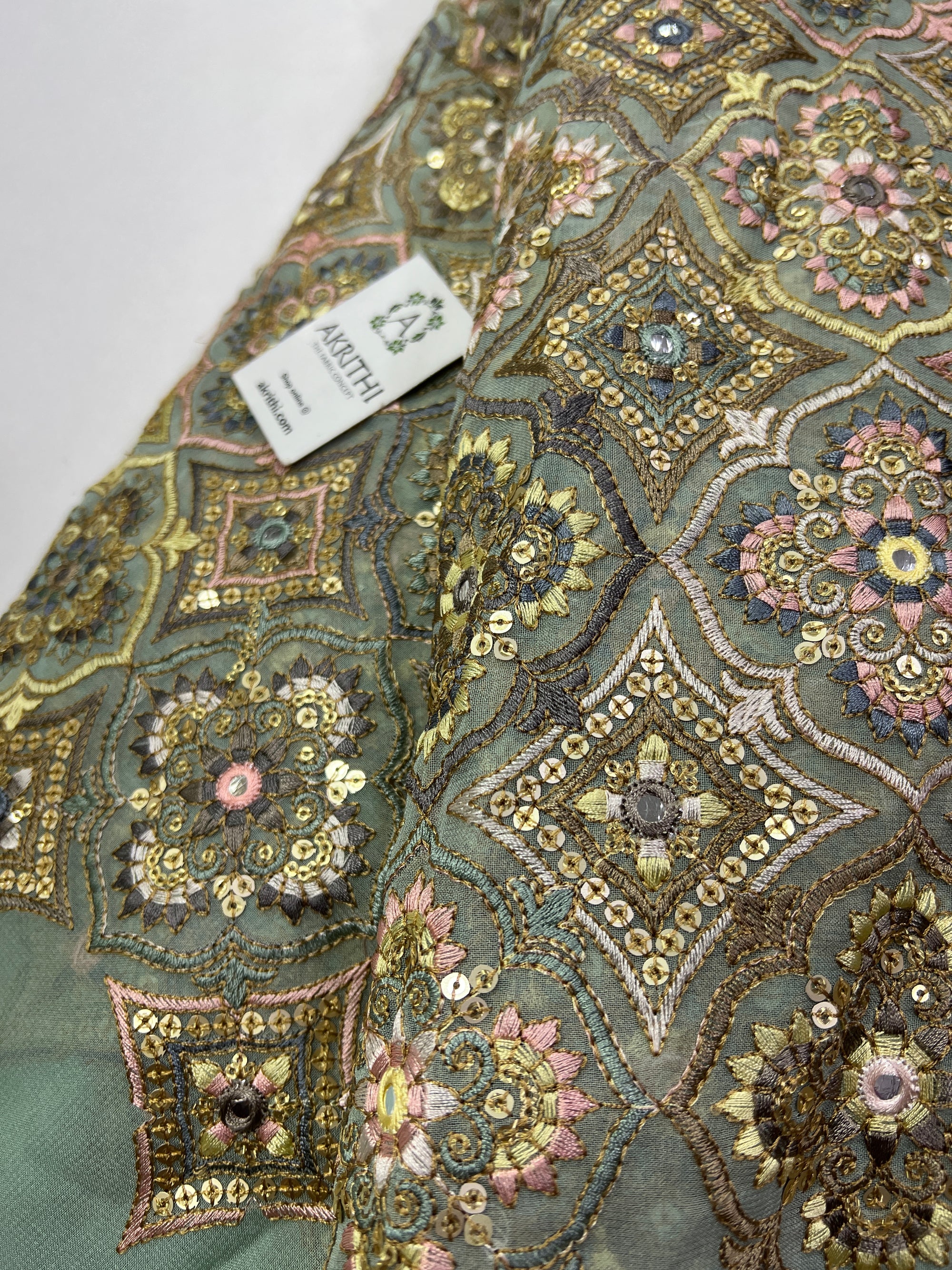 Heavy Embroidery on slate green Georgette fabric
