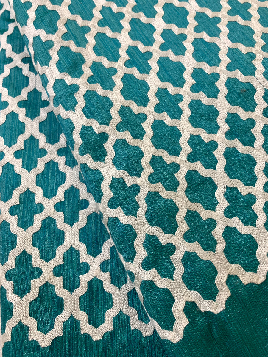 Embroidery on blue raw silk fabric