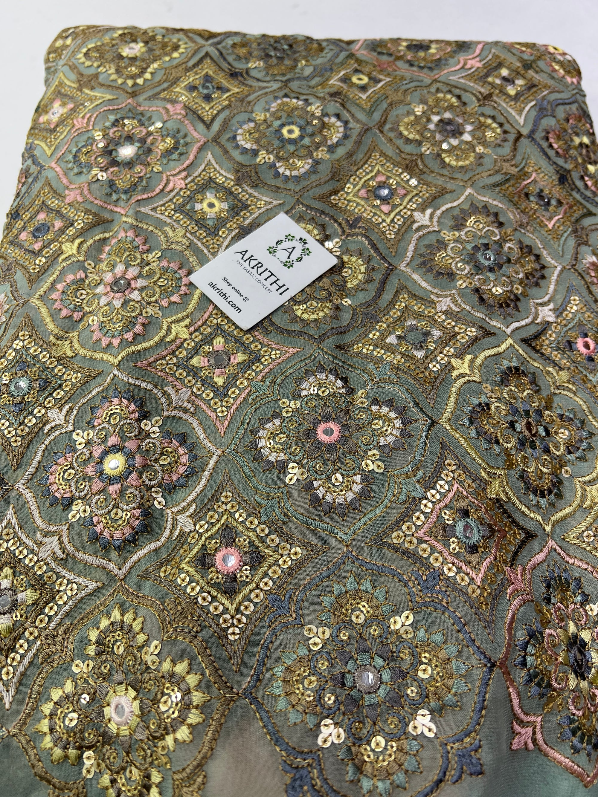 Heavy Embroidery on slate green Georgette fabric