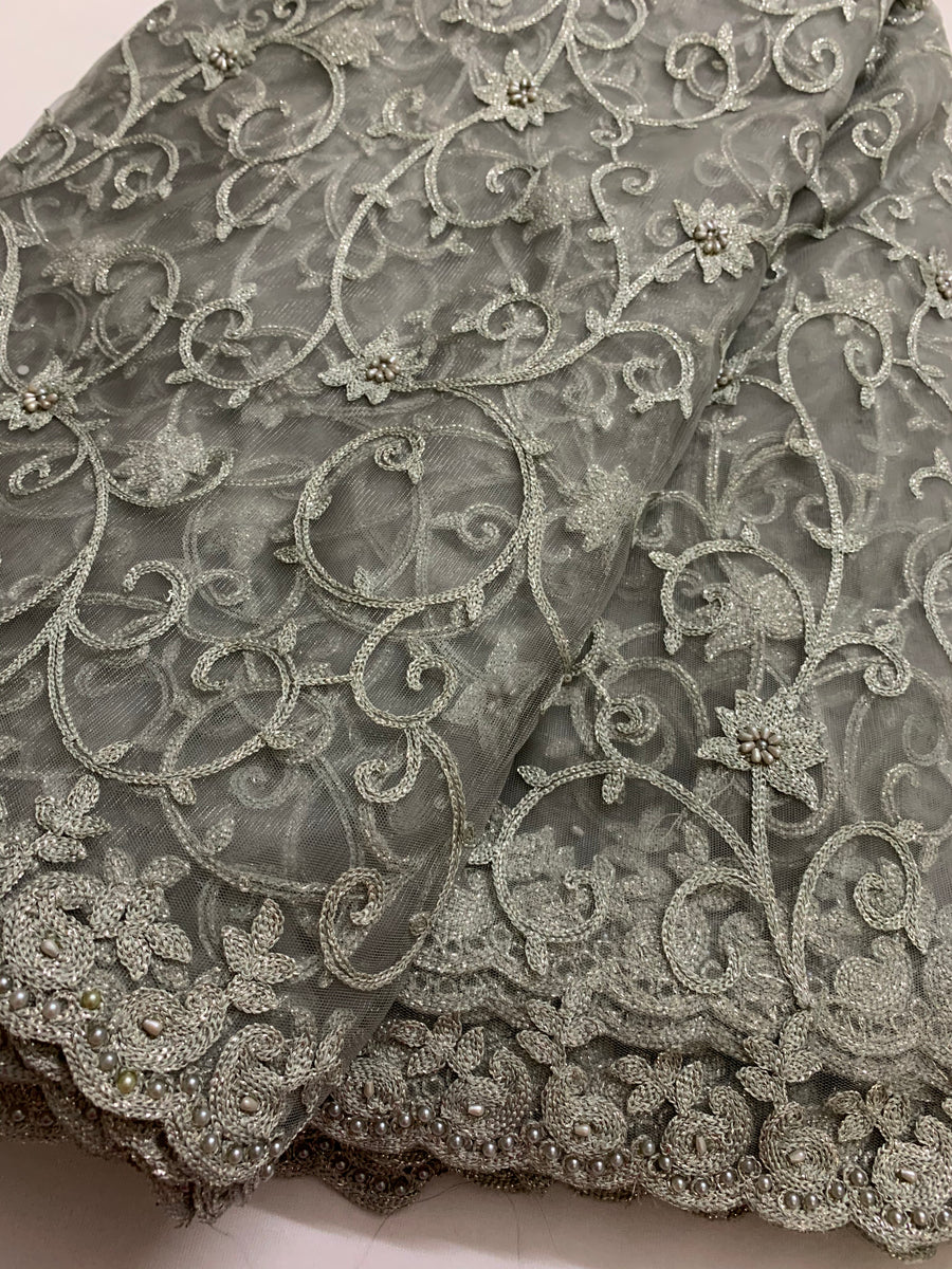 Embroidery on grey net fabric