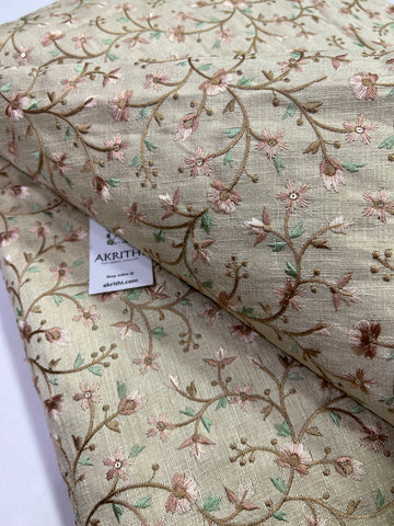 Embroidery on beige raw silk fabric