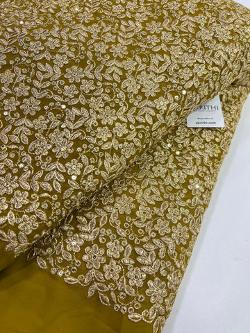 Embroidery on mustard yellow georgette fabric